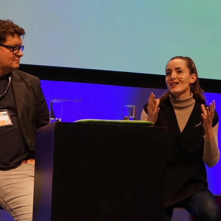 Miriam Janke speaking at event